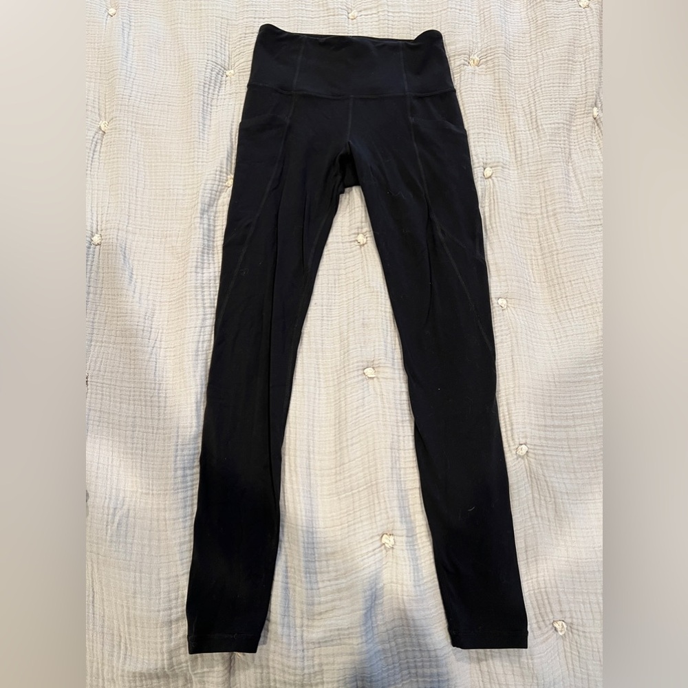 Athleta Stash Pocket Salutation Tight